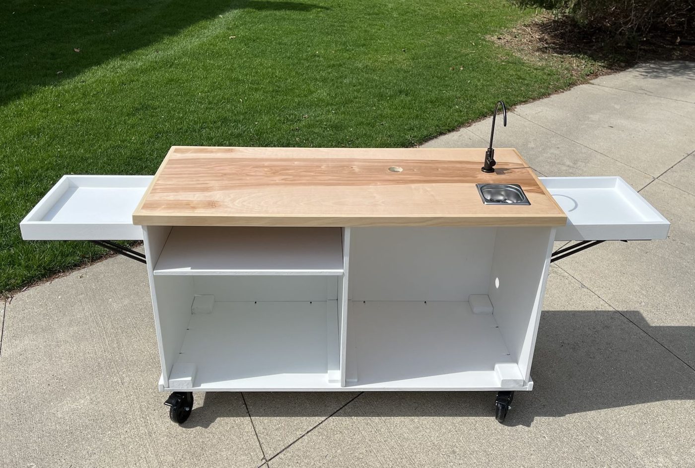 Back of the same cart: open with a drop-in sink, pitcher rinser and prep space