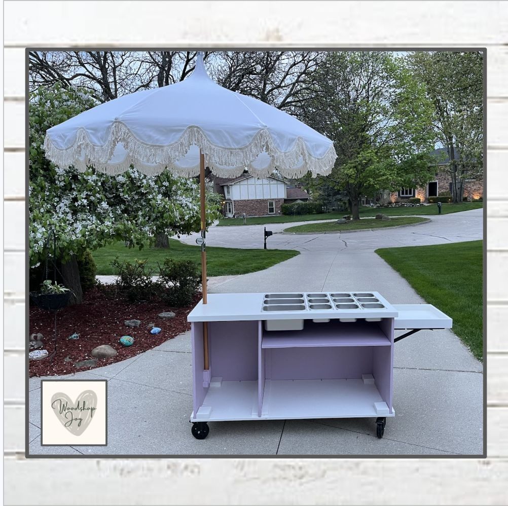 Custom cart painted dreamy lavender with a decorative umbrella