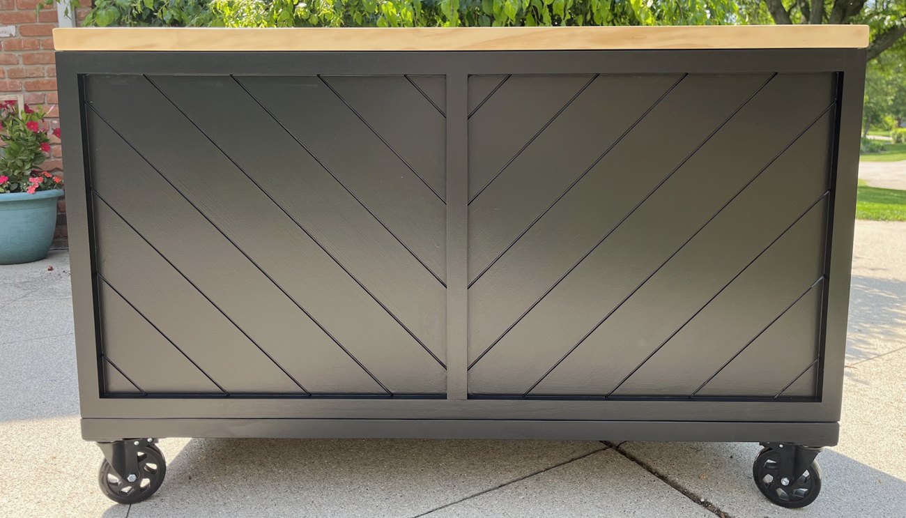 Black cart with a chevron-pattern slat front and a natural wood top